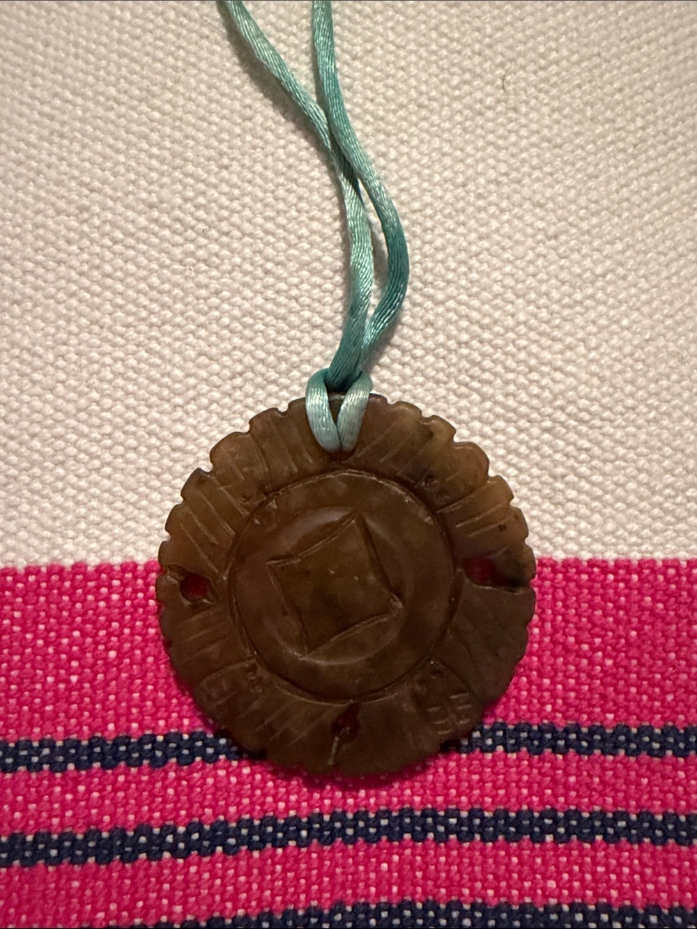 Carved Brown Jade-Look Pendant on Aqua Cord